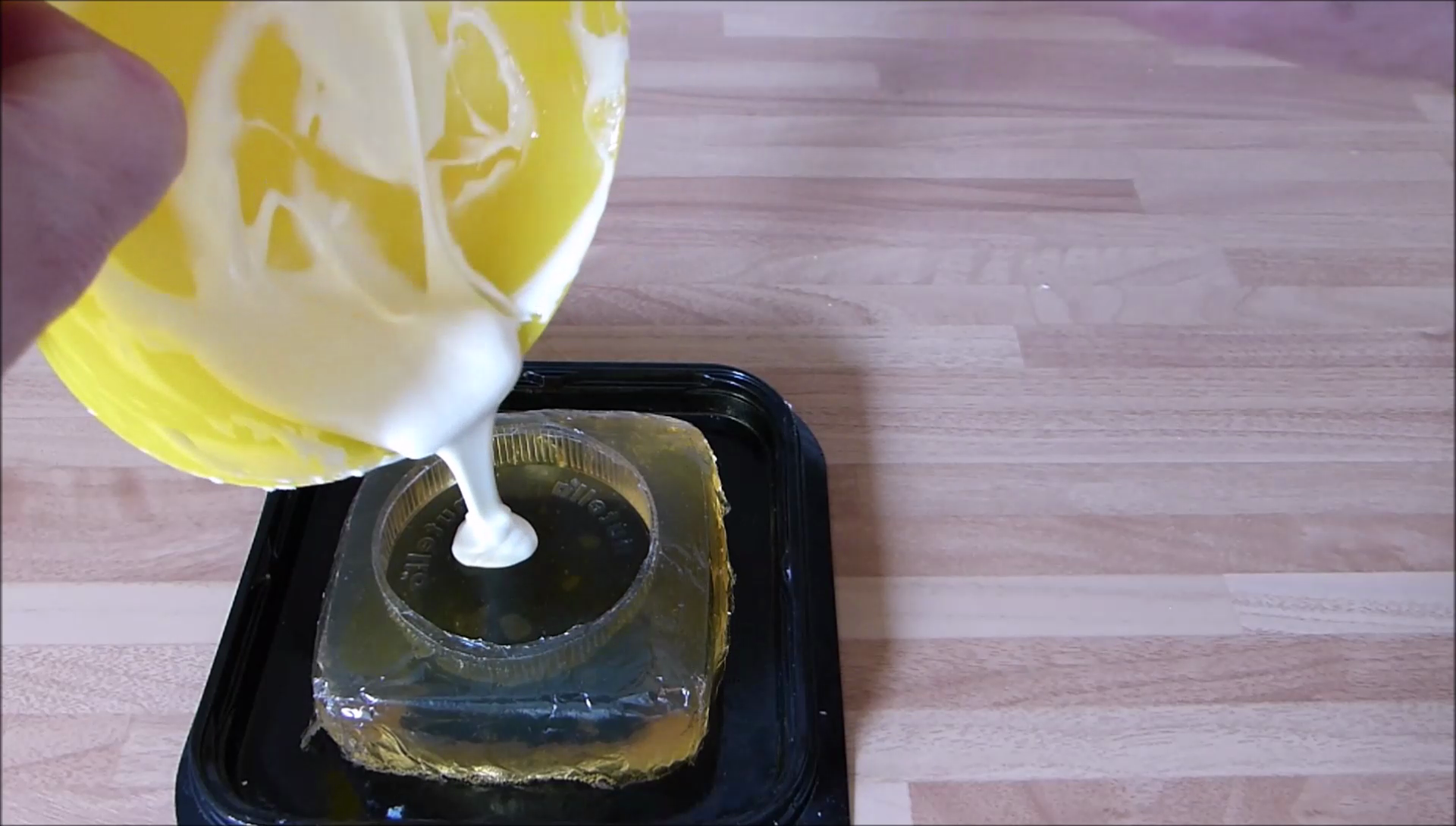 202 pour white chocolate into lid mould.png