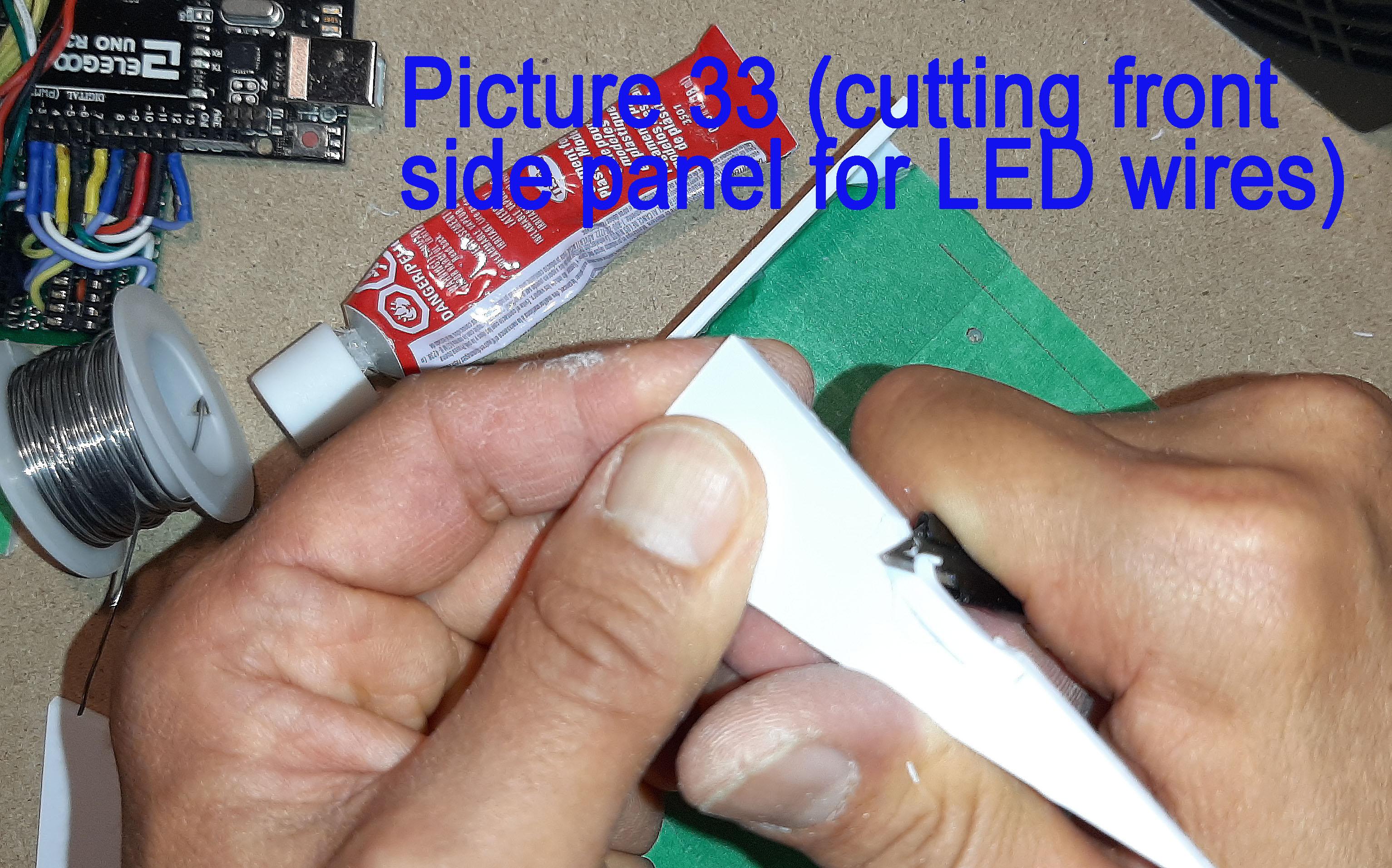 33 CuttingHoleForGunWires copy.jpg