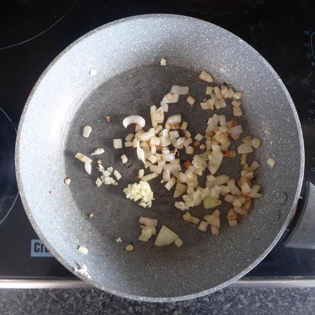 onions cooked in blue frying pan.JPG