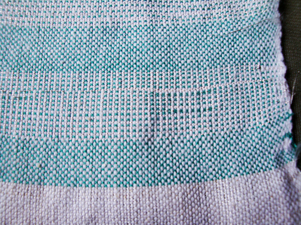 weaving with silver thread.jpg