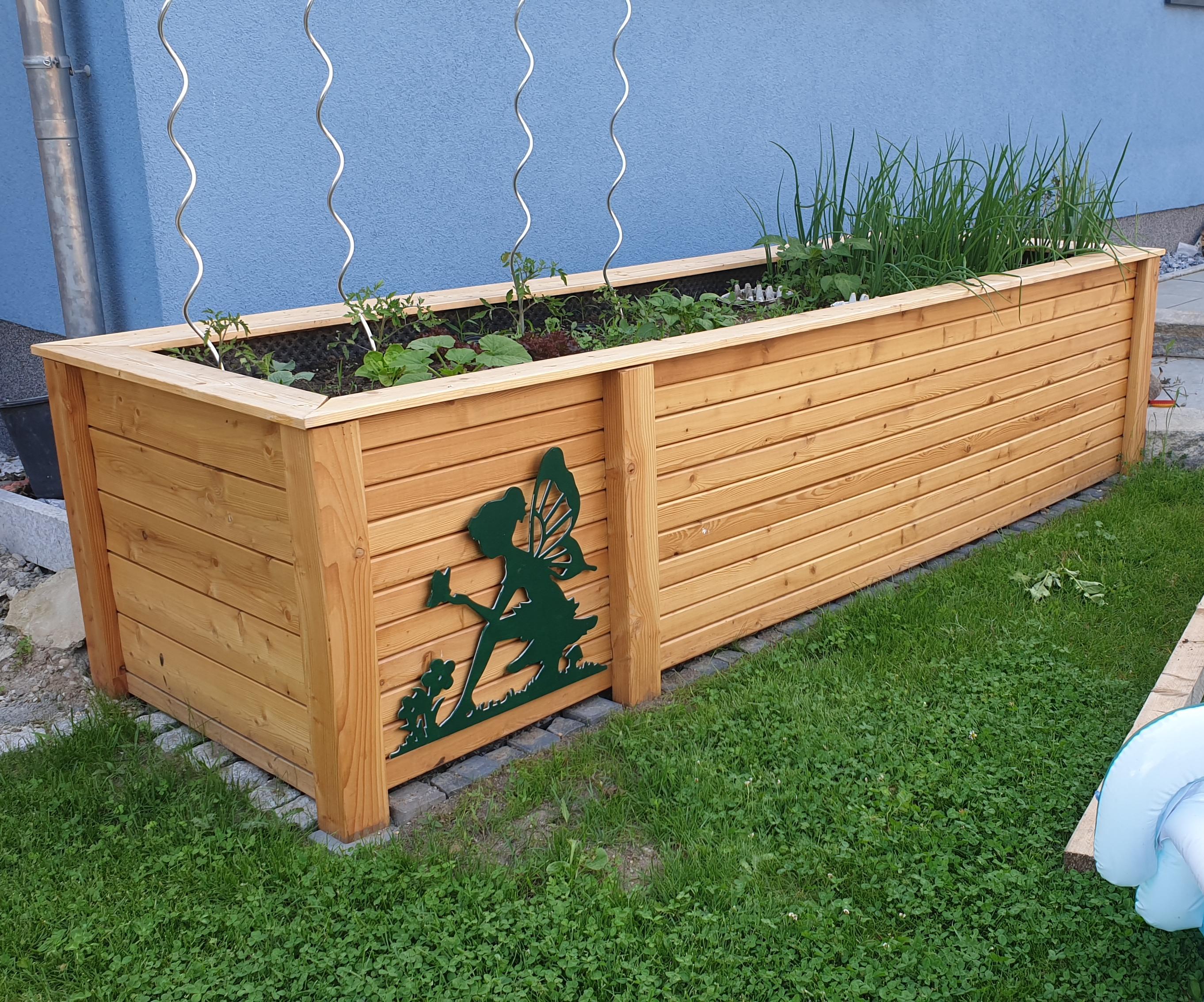 Raised Garden Bed With an Decorative Eye Catcher