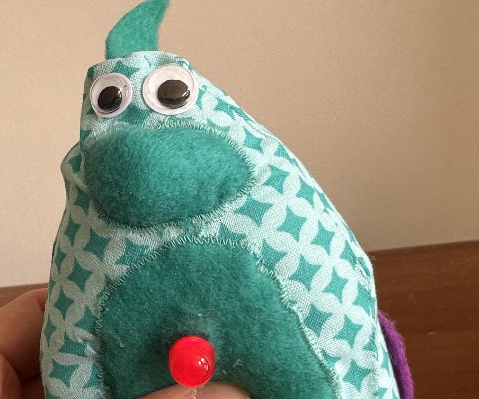 Soft-sensor-saurus | An E-textile Soft Sensor Soft Toy With LED Light