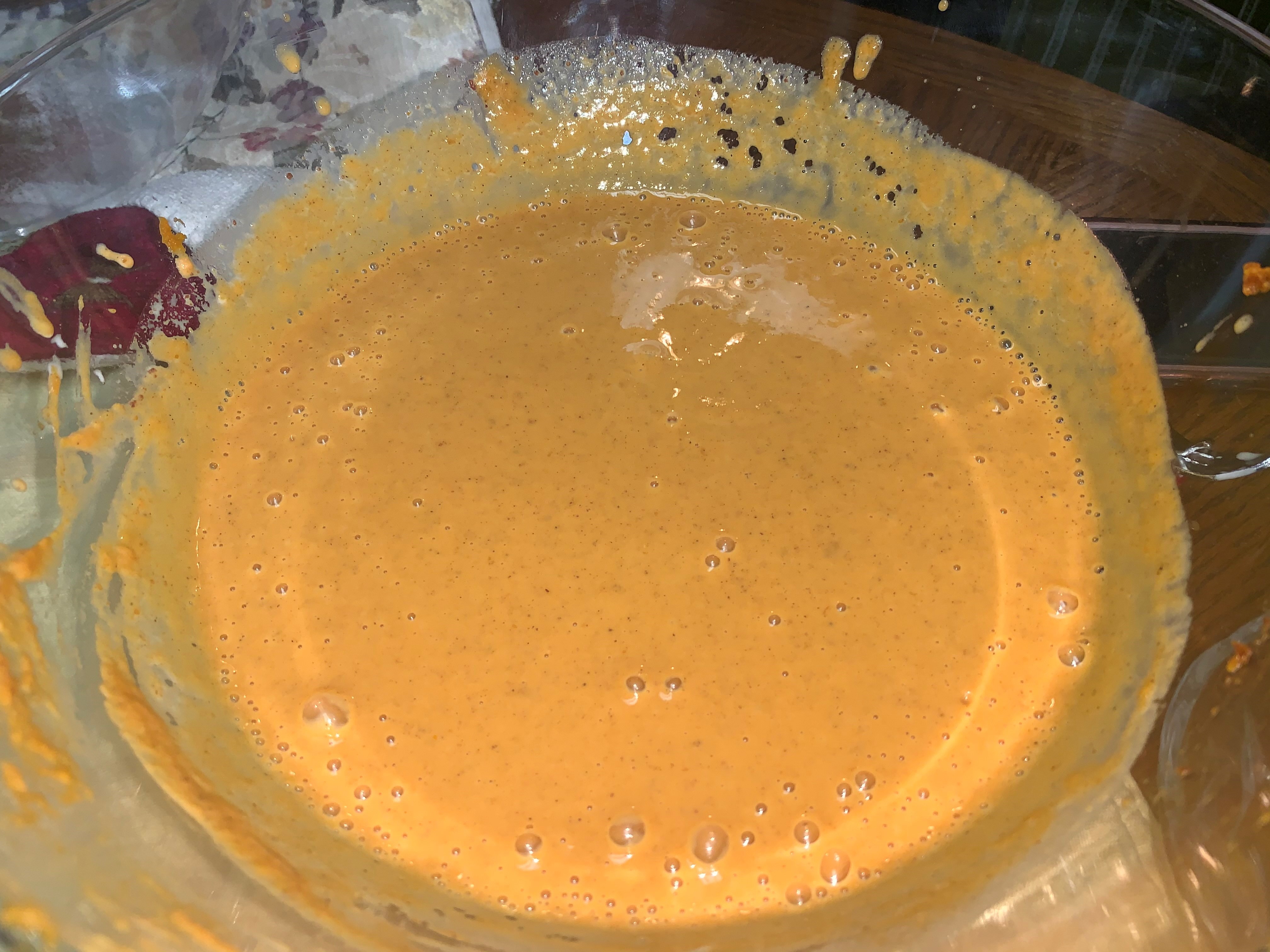 step 12 mix all dry ingredients into a large bowl while gradually pouring in the carnation milk and Libby's pure pumpkin.jpg