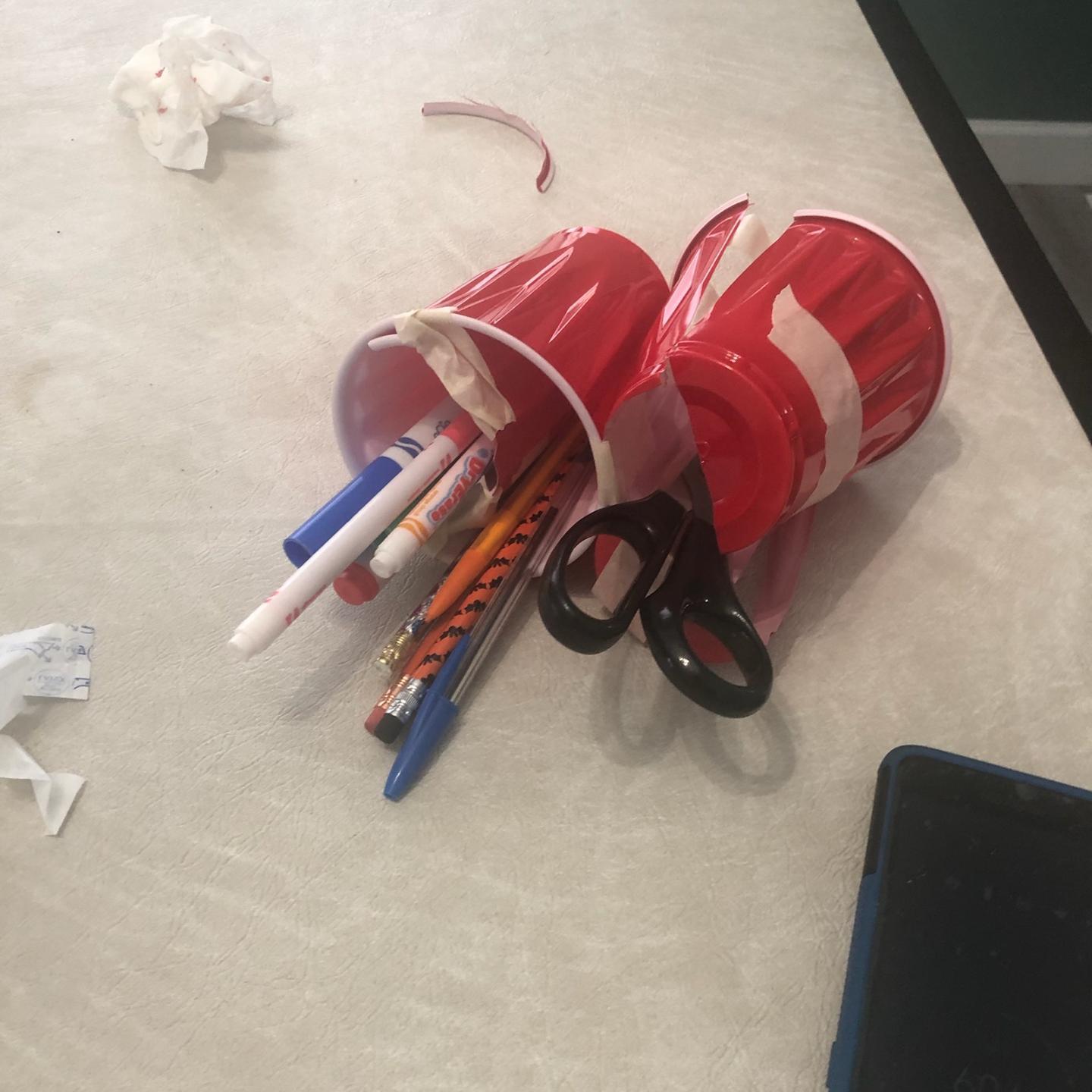 A Pencil, Marker, Scissor Holder With Phone Stand