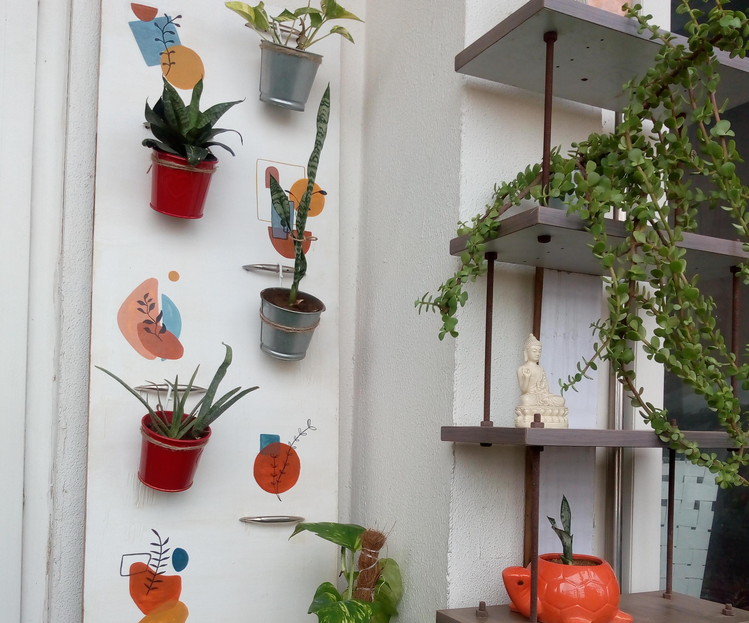 DIY Vertical Plant Stand Using Scrap Wood and Door Handles.