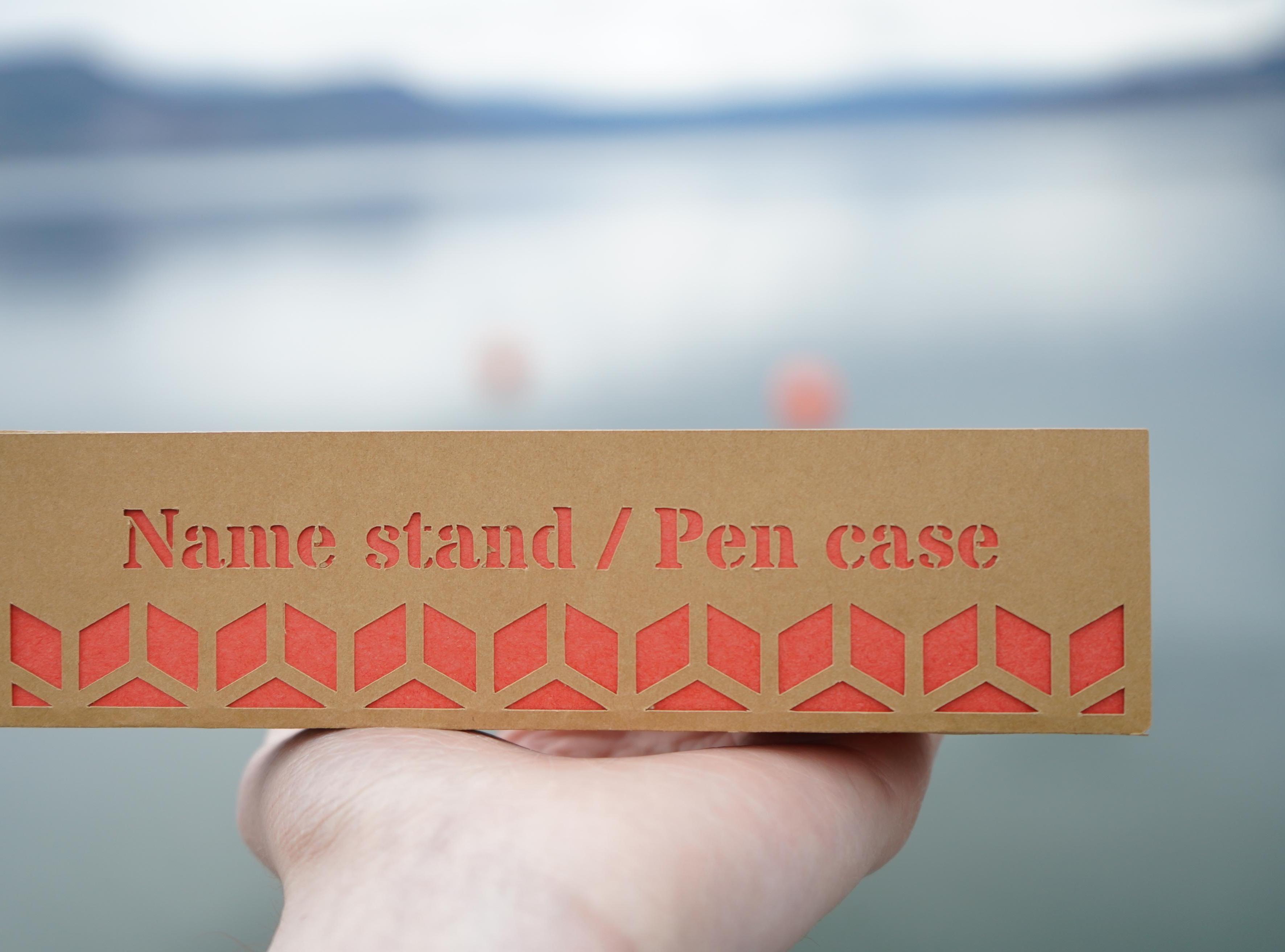 A Unique Nameplate Which Carries a Pen!