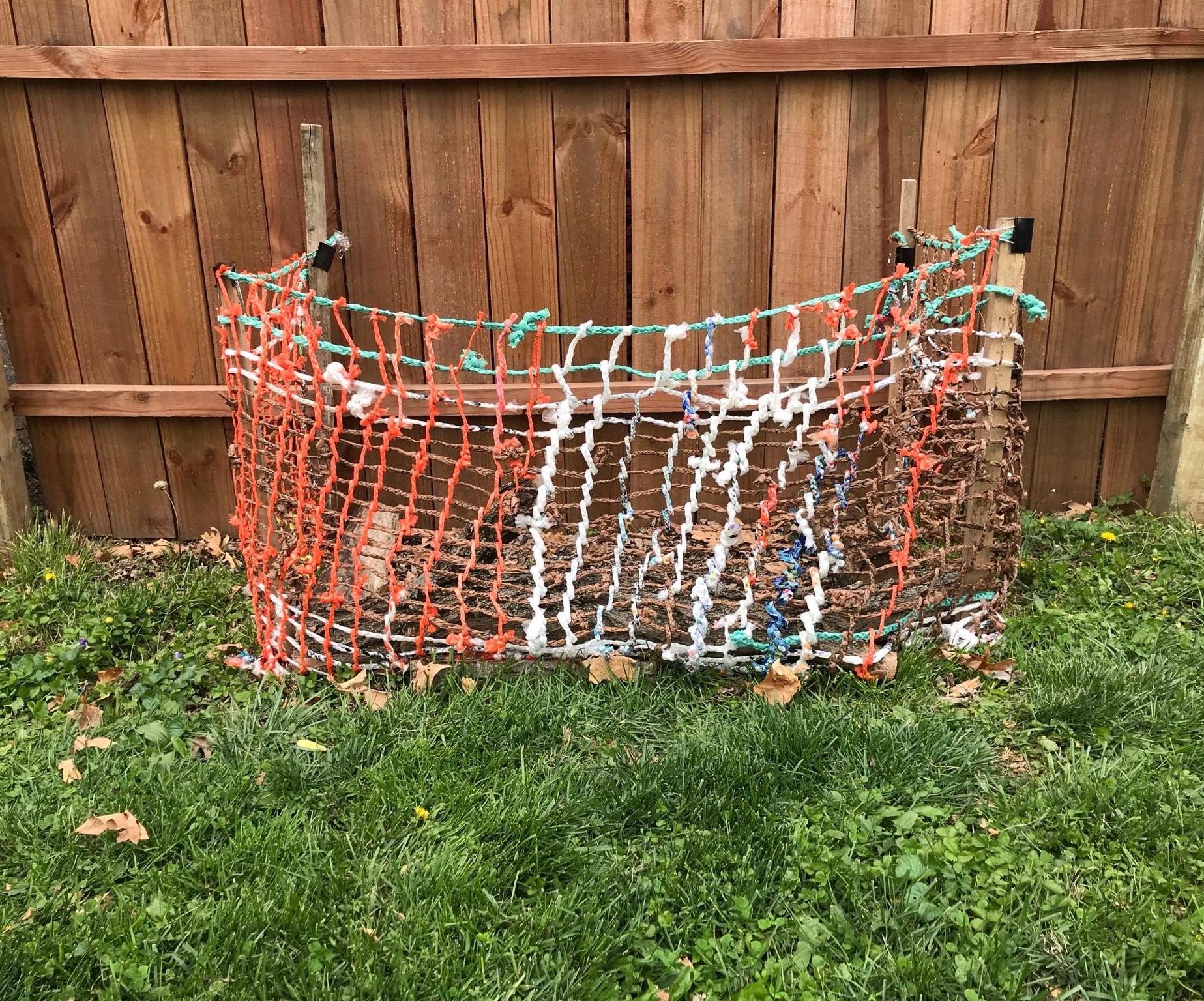 Repurpose Plastic Bags to Make a Garden Fence
