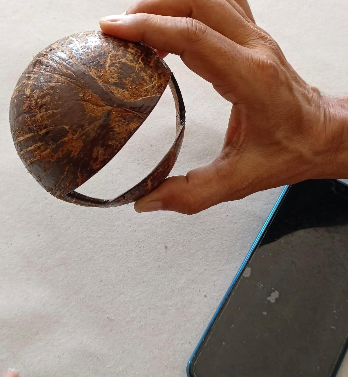 Fancy Mobile Holder Made of Coconut Shell..